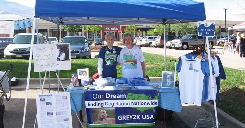 Katherine and Pam host a GREY2K USA table at a dog expo in Colorado.